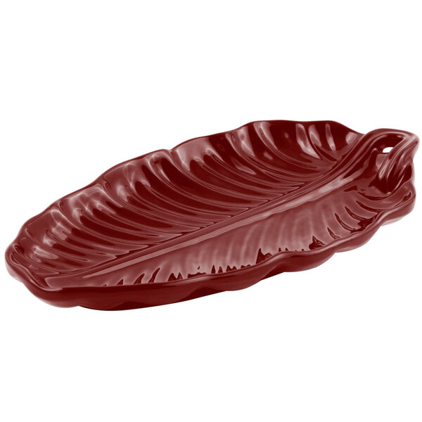 A red Bon Chef leaf platter with a sandstone finish.