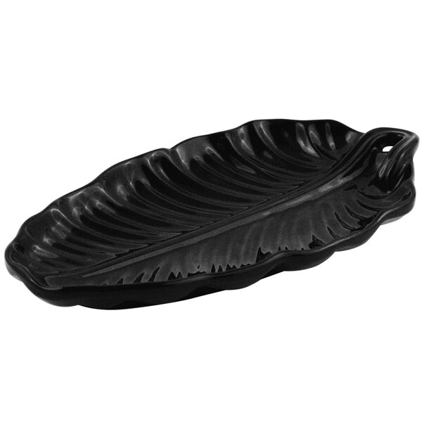 A black Bon Chef leaf-shaped platter with a handle.