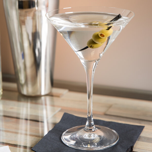 A Spiegelau Vino Grande martini glass with an olive on top.
