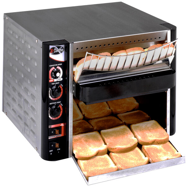 An APW Wyott conveyor toaster oven with slices of bread inside.