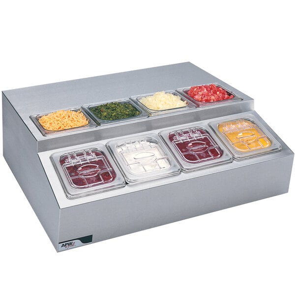 An APW Wyott refrigerated countertop rail with 8 compartments holding different food items.