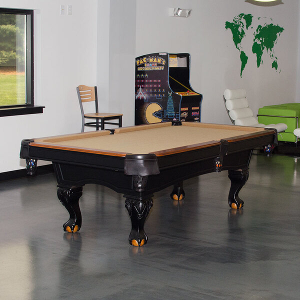 A Minnesota Fats Covington pool table in a room.