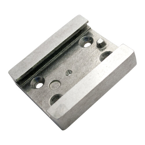 A white metal Nemco locator base with two holes.