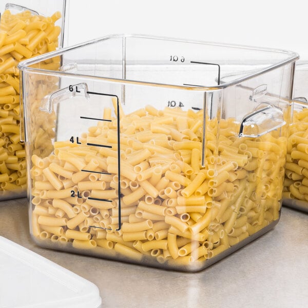 A Rubbermaid clear polycarbonate container with pasta inside.