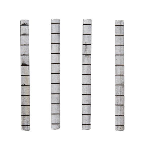 A group of metal bars with white marble strips on the ends.