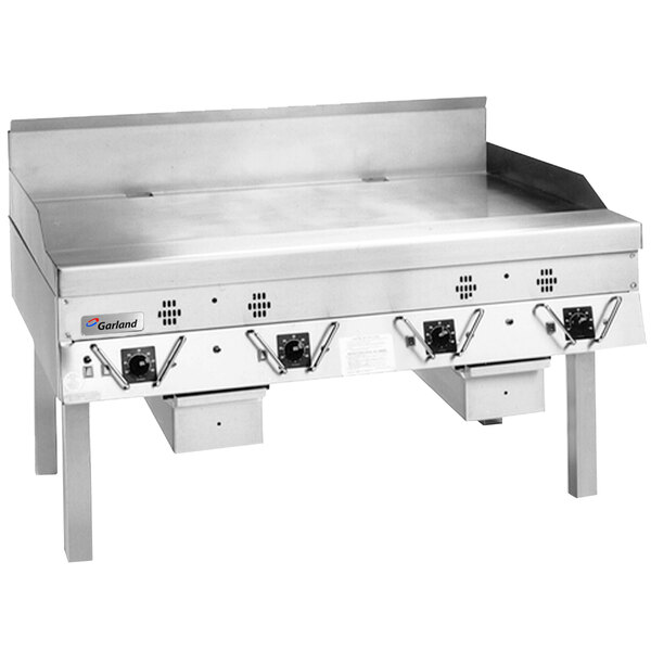 A large stainless steel Garland Master Series gas griddle with thermostatic controls.