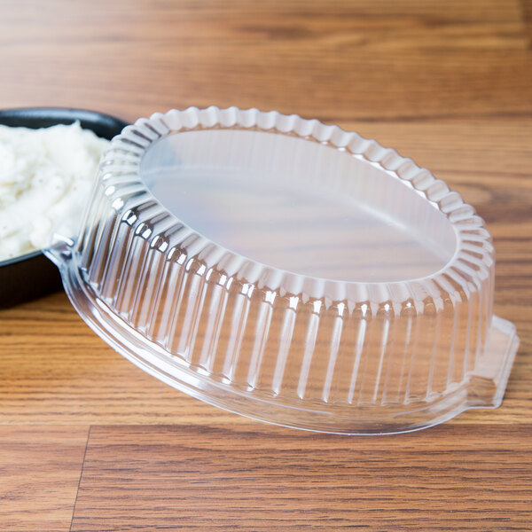 A clear plastic Dart casserole dish with a dome lid.