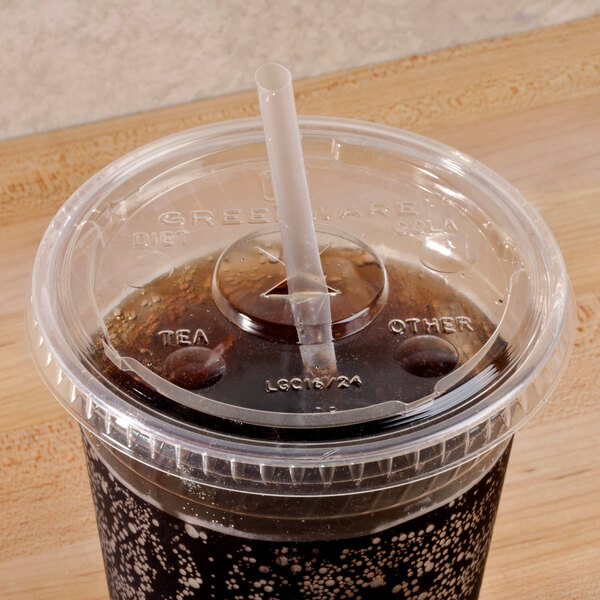A Fabri-Kal Greenware clear plastic lid with a straw slot on a plastic cup with a straw.