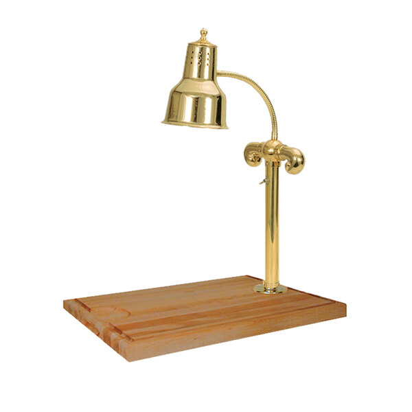 A brass Hanson Heat Lamp on a wood carving station.