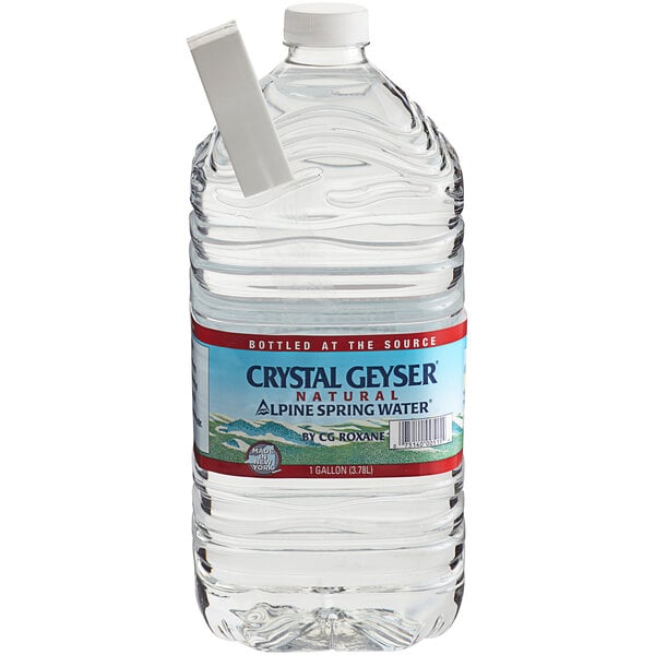 A case of Crystal Geyser Natural Spring Water bottles with white labels.