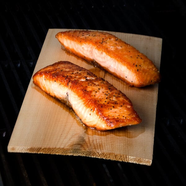 Two pieces of salmon on an American Metalcraft cedar wood grilling plank.