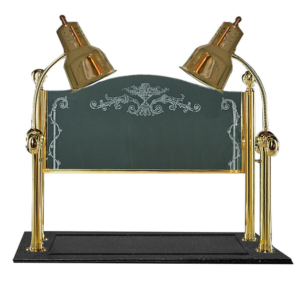 A brass Hanson Heat Lamps carving station with two lamps on a black synthetic granite base under a brass sneeze guard.