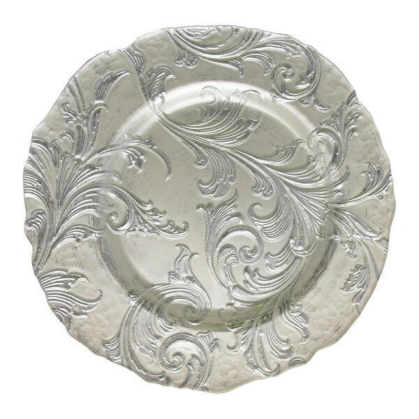 A silver Charge It by Jay glass charger plate with a swirl design.