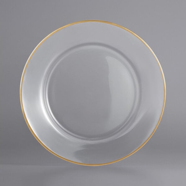 A clear glass plate with a gold rim.