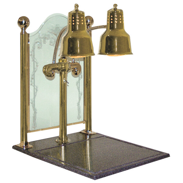 A Hanson Heat Lamps brass carving display with synthetic granite base and sneeze guard over a marble table.