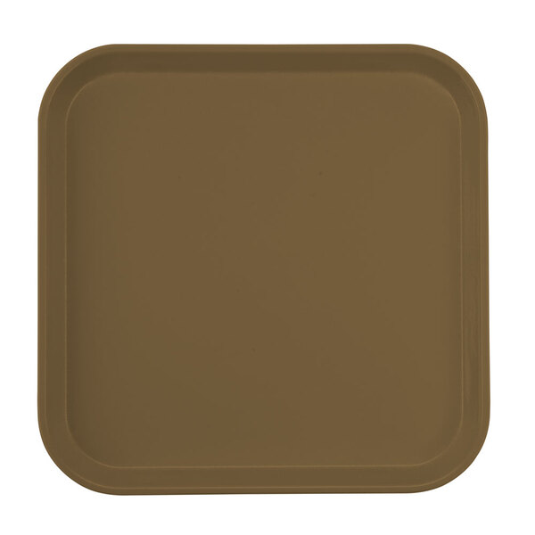 A brown square Cambro tray with a white surface.