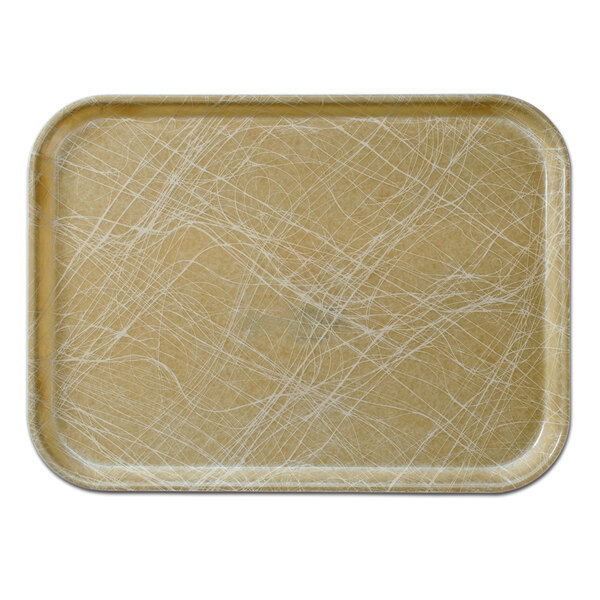 A rectangular Cambro tan fiberglass tray with white abstract lines on a brown surface.
