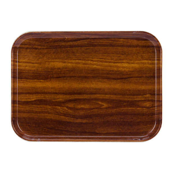 A rectangular wooden Cambro tray with a dark wood finish.