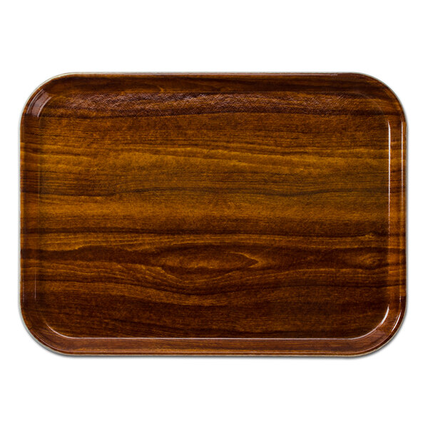 A rectangular Cambro Burma Teak fiberglass tray with a wood finish.