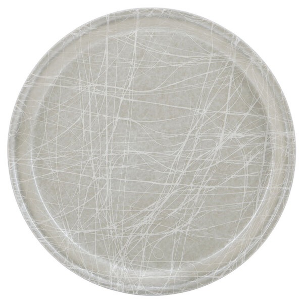 A white Cambro round fiberglass tray with a white and gray abstract design.