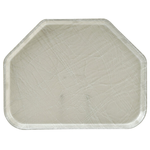 A white Cambro trapezoid tray with cracks in the surface.