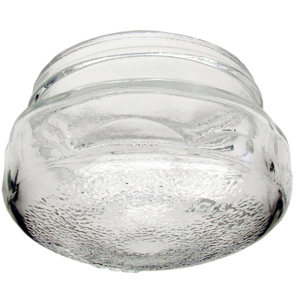 A clear glass jar with a textured surface and a lid on top.