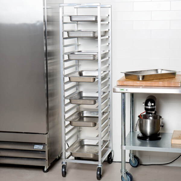 An aluminum Channel steam table pan rack holding metal trays.