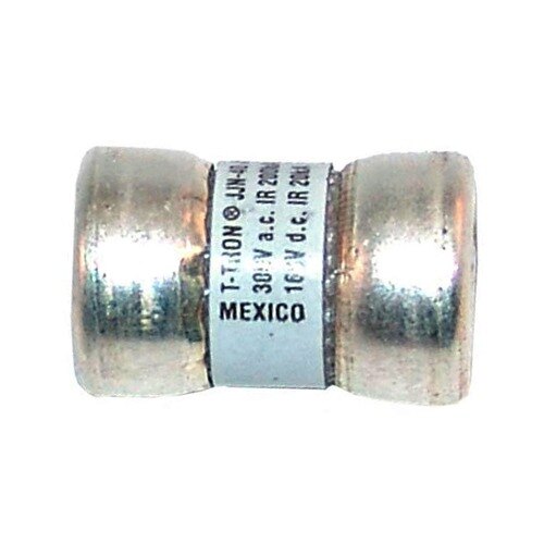 A close-up of a silver metal T-Tron fuse with "Mexico" on it.