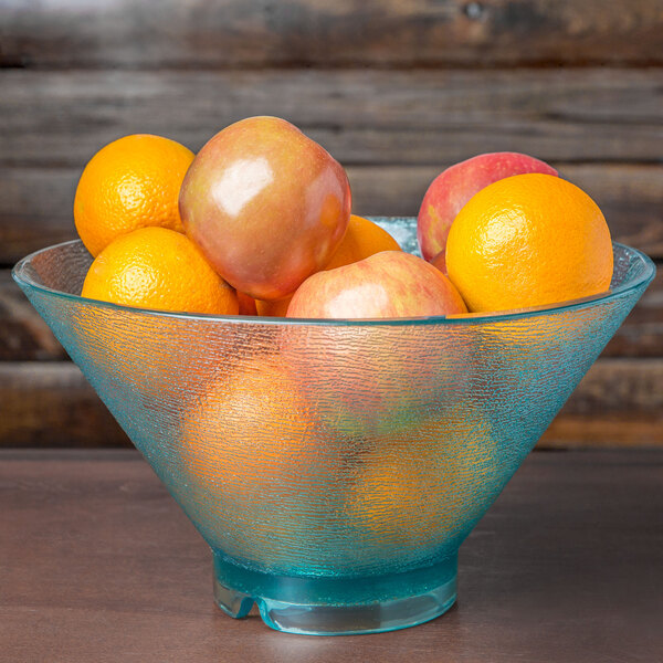 A bowl of fruit including apples and oranges served in a jade polycarbonate serving bowl.