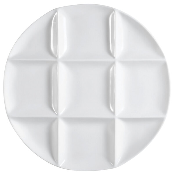 A CAC Bright White Porcelain round tasting tray with 9 compartments.