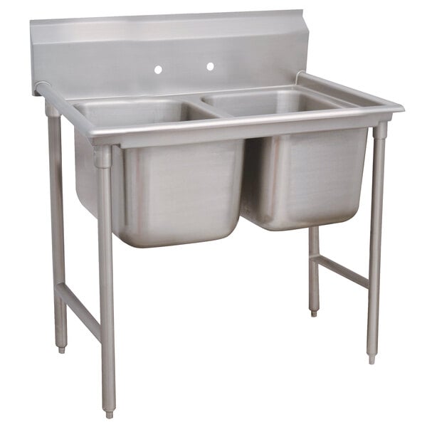 A stainless steel Advance Tabco Regaline two compartment sink with two bowls.