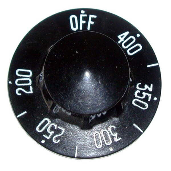 A black knob with white numbers on a black surface.