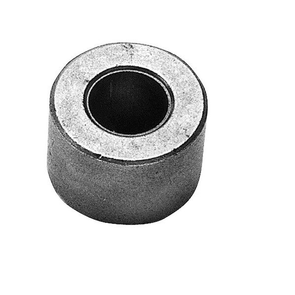 A close-up of a round black metal front bearing bushing with a hole in the center.