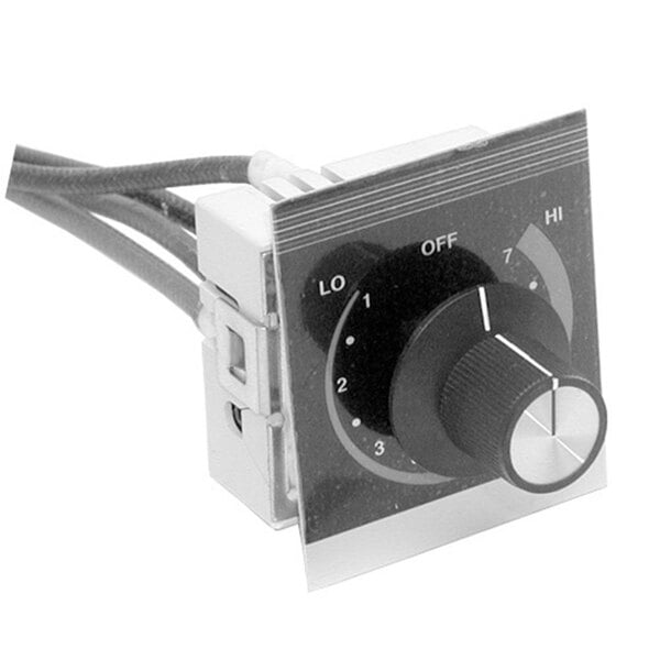 A black and white close-up photo of a dial with a label and knob.
