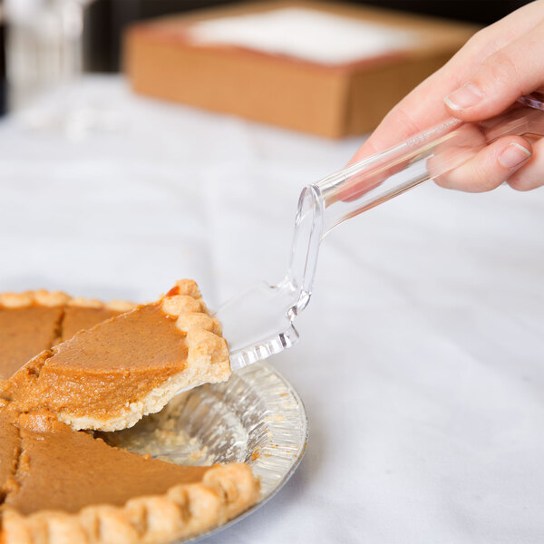 A person using a Fineline clear plastic pie server to cut a pie.