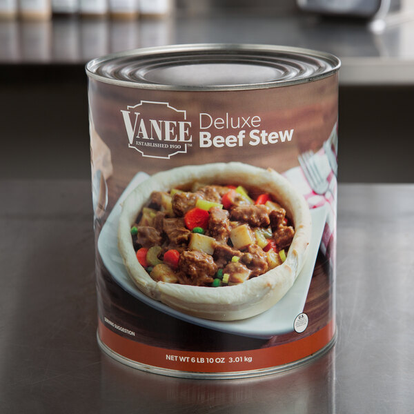 A #10 can of Vanee Deluxe Beef Stew on a table.
