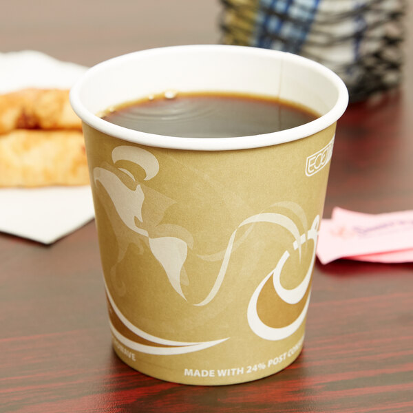 A close-up of an Eco-Products Evolution World paper hot cup filled with coffee on a table.