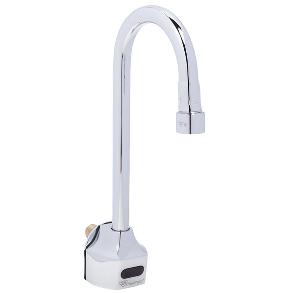 A close-up of a T&amp;S silver wall-mounted electronic sensor faucet.