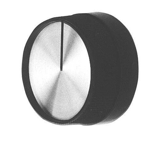 A close-up of a black and white knob with a pointer.