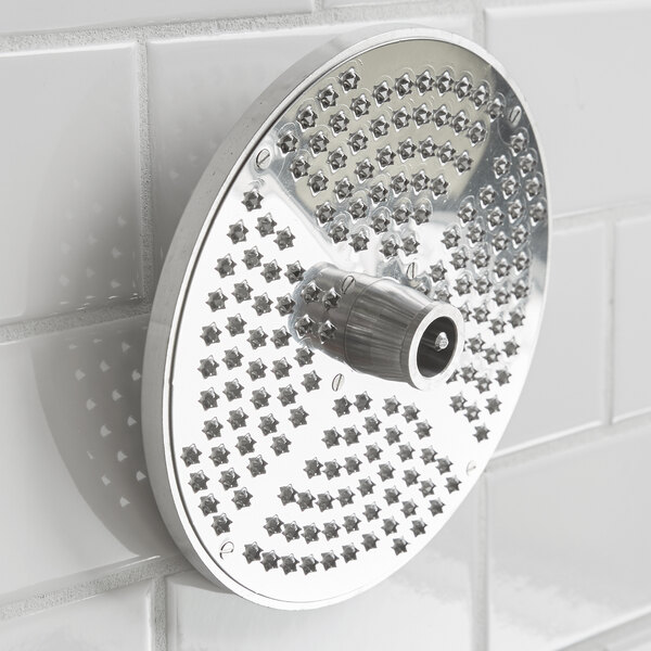 A circular metal Hobart hard cheese grater plate with holes.