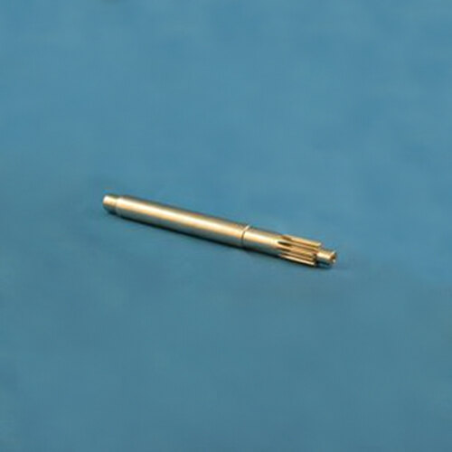 A metal pen with a silver tip on a blue surface.