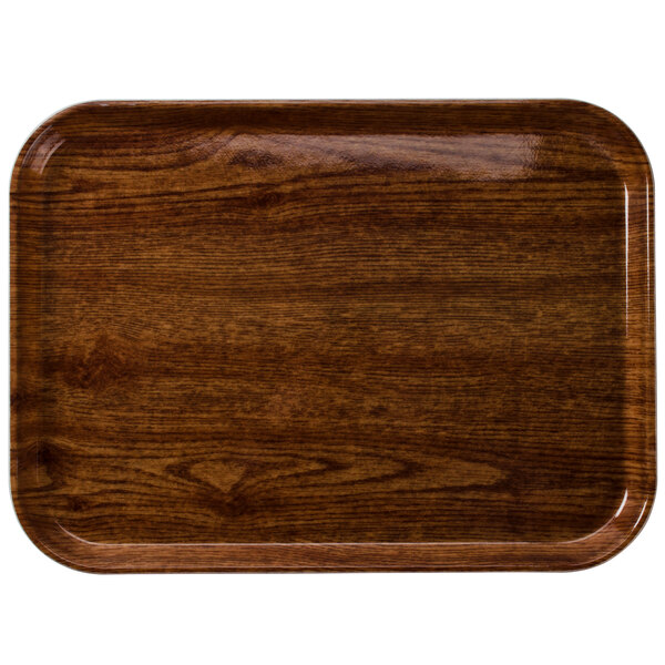 A rectangular Cambro Country Oak fiberglass tray with a dark wood finish.