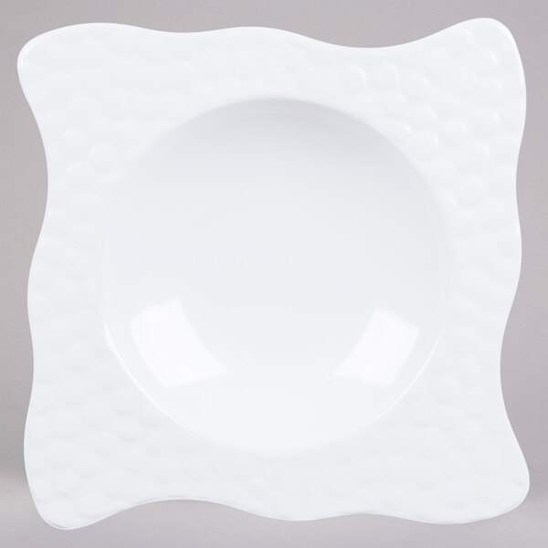 A white square melamine bowl with a wavy edge.