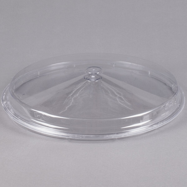 A clear plastic bowl cover with a dome on top for a Cornelius refrigerated beverage dispenser.