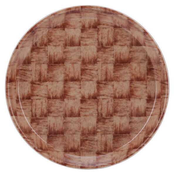A close-up of a brown Cambro round tray with a basketweave pattern.