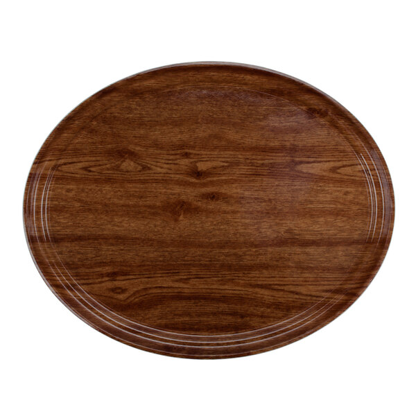 A wooden oval Cambro tray with a white border.