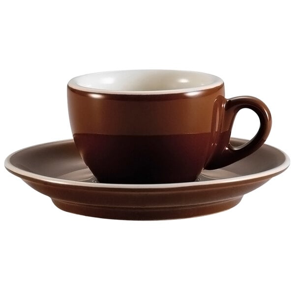 A brown CAC Venice coffee cup and saucer on a table.