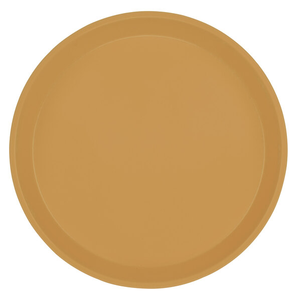 A close-up of a Cambro round yellow fiberglass tray with brown edges.