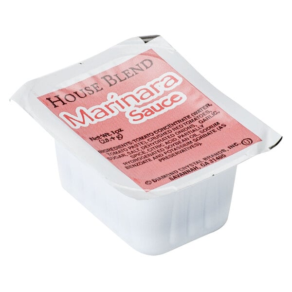 A small white plastic container with a red label reading "House Blend Marinara Sauce" on it.