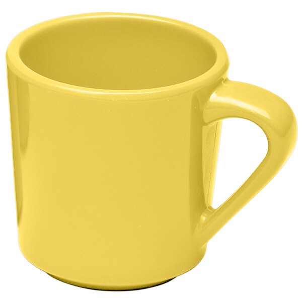 A yellow melamine mug with a yellow handle.